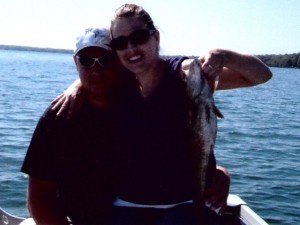 willi and carry on lap on boat with bass 06-29-09